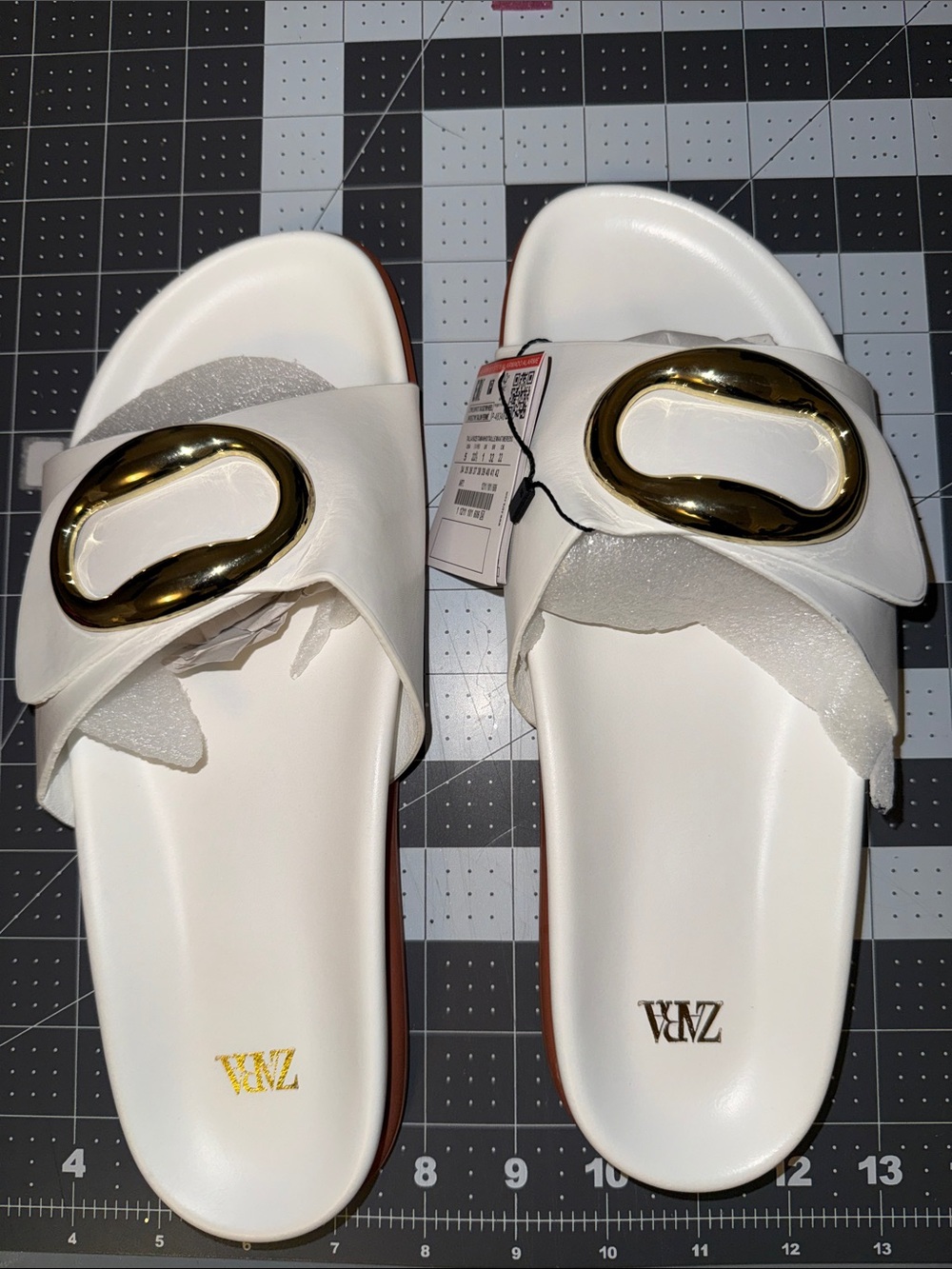 Zara White Slide Sandals with Gold Oval Accent